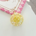 Detail of yellow resin button featuring colorful cloud sequins and a four-hole design - Adhesive Large Button Cloud Pearlescent / Yellow