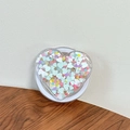 Dettaglio del supporto per telefono a cuore con paillettes macaron in acrilico trasparente - Cuore di Paillettes Magnetico n. 1