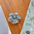 Macro shot of 3D floral phone socket with grey speckled texture on wooden desk - Cherry Blossom Socket - Ink Style - Gray