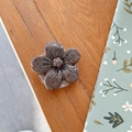 Macro detail of brown floral Griptok with marble texture on a natural wooden surface - Cherry Blossom Socket - Ink Style - Coffee
