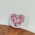 Macro view of heart-shaped phone grip with pink star sequins and white base - Magnetic Sequin Heart No. 7
