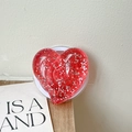 Macro view of red glitter heart phone grip with sparkling resin texture and white base - Large Crooked Heart - Dot Glitter - Magnetic / Translucent Red