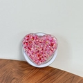 Close-up of heart-shaped phone griptok with pink glitter and red sequins on wood surface - Magnetic Sequin Heart No. 9