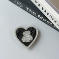 Macro shot of heart-shaped magnetic phone holder with black leather texture and bear detail - Transparent Stand-Snakeskin Heart Bear Mirror-Black
