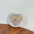 Macro shot of heart-shaped phone grip filled with gold and silver glitter sequins - Magnetic Sequin Heart No. 13