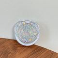 Detail of heart-shaped phone grip with colorful laser sequins and white expandable base - Magnetic Sequin Heart No. 14