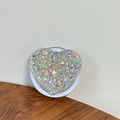 Detailed view of heart-shaped phone grip filled with silver laser sequins and star glitter - Magnetic Sequin Heart No. 16