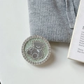Macro shot of mint green magnetic bear phone grip with sparkling rhinestone details - Transparent Stand Style / Green