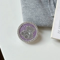 Close-up of a purple rhinestone phone socket with a silver bear design on a white surface - Transparent Stand Style / Purple