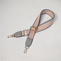 Close-up of pink and grey striped wide canvas bag strap with golden lobster clasps - Gray