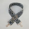 Detail of adjustable snakeskin pattern bag strap with gold-tone rotating metal buckles - Silver Clasp / Gray