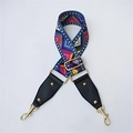 Detail of adjustable woven wide shoulder strap with ethnic geometric patterns and gold clips - Geometric Film