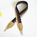 Detail of adjustable wide striped nylon shoulder strap with leather ends and gold buckles - Black Coffee Stripes + Light Khaki