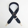 Detailed view of black nylon woven bag strap with golden metal hardware and swivel hooks - Solid Black