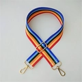Macro detail of adjustable multi-color striped fabric bag strap with golden metal clasps - Rainbow Stripes