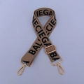 Close-up of khaki woven strap with bold black letters and gold metallic hardware - Style 4 Silver Buckle