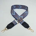 Close-up of geometric V-pattern wide woven bag strap with golden metal swivel hooks - No.4 Blue Pattern + Black Leather Trim