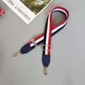 Detail of adjustable striped webbing strap with navy PU leather and gold lobster clasps - Blue/White/Red With Blue Leather