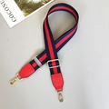 Detail of adjustable red and blue striped woven shoulder strap with gold metal hooks - Blue/Red/Blue With Red Leather