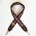 Close-up of wide jacquard bag strap with ethnic horse patterns and gold hardware - Flame Mountain Pattern + Coffee Leather Ends + Gold Hook