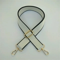 Adjustable wide canvas shoulder strap in off-white with black trim and gold hardware - White