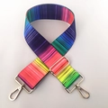 Close-up of adjustable rainbow striped shoulder strap with gold metal lobster clasps - US 1