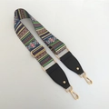 Detail of adjustable ethnic style bag strap with colorful woven pattern and gold hooks - Green Stripe