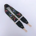 Detail of adjustable butterfly print strap with premium gold hardware and leather ends - Butterfly