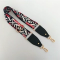 Close-up of adjustable ethnic bag strap with red, black, and white geometric patterns - Rainbow