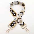 Detail of colorful geometric woven bag strap with golden metal swivel lobster clasps - Yellow Black White / Silver Clasp