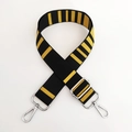 Close-up of adjustable striped canvas bag strap with silver metal hooks and buckle - Yellow Black Silver Buckle