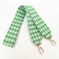 Detail of green and white houndstooth shoulder strap with gold metal swivel clasps - Green