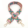Detail of colorful ethnic bohemian woven wide bag strap with golden metal swivel hooks - Rose Pink Green Brown / Silver Clasp
