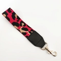 Detail of red and black leopard print woven strap with leather end and golden lobster clasp - Red