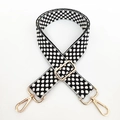 Close-up of black and white woven strap with adjustable gold-toned metal buckles - Gold Buckle/Polka Dot / Black