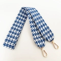 Detail of blue and white houndstooth fabric shoulder strap with gold metal swivel clasps - Blue