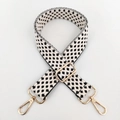Detail of black and white star pattern woven bag strap with golden metal carabiners - Gold Buckle/Houndstooth / White