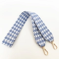 Detailed view of the blue and white houndstooth wide bag strap with gold metal lobster hooks - Aqua