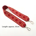 Close-up of red and beige geometric canvas strap with golden metal lobster clasps - Short Style / Burgundy