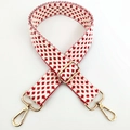 Close-up of red and white geometric jacquard bag strap with polished gold metal buckles - Silver Clasp / A-Style Red