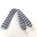 Close-up of houndstooth jacquard shoulder strap with premium gold metal lobster clasps - Dark Blue