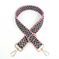 Close-up of colorful woven geometric bag strap with premium gold metal swivel hooks - Gold Buckle / Pink
