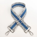 Detail of adjustable blue and black spotted canvas bag strap with silver metal swivel hooks - Blue White Silver Buckle