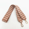 Close-up of brown houndstooth wide woven shoulder strap with gold lobster clasps - Beige Brown