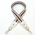Detail of striped brown and white woven shoulder strap with gold metal hooks - Nude Pink Khaki + White Leather