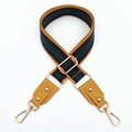 Detail of adjustable bag strap with colorful stripes and gold-tone metal swivel hooks - Yellow Green + Yellow Leather