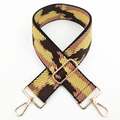 Close-up of adjustable wide woven bag strap with geometric patterns and gold metal clips - Black Coffee and Yellow