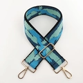 Detail of adjustable blue geometric woven bag strap with golden metal swivel hooks - Black Frame Light Blue Lens
