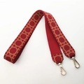 Macro detail of red woven shoulder strap with gold metal hooks and geometric pattern - Long Style / Burgundy