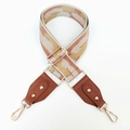 Close-up of geometric woven wide bag strap with brown leather and gold hardware - Khaki Brown